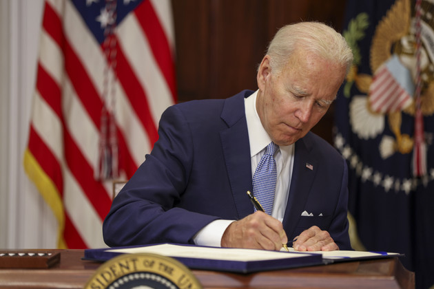 President Joe Biden signs the Bipartisan Safer Communities Act into law. 